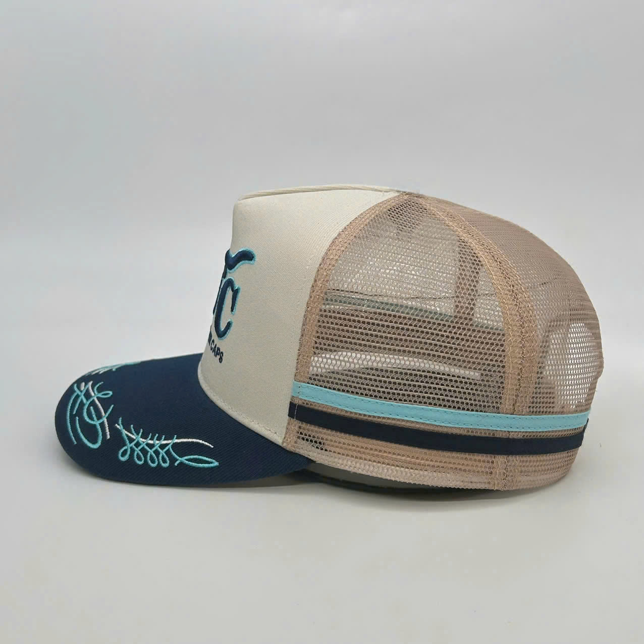 CREAM NAVY TRUCK SCROLL TRUCKER CAP