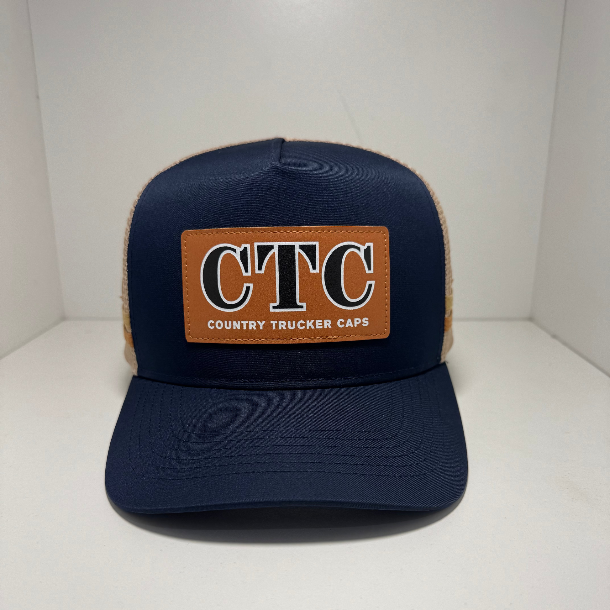 NAVY SUNGLASS HOLDER TRUCKER CAP