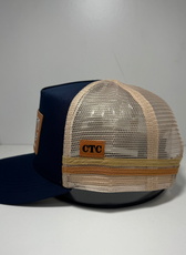 NAVY SUNGLASS HOLDER TRUCKER CAP