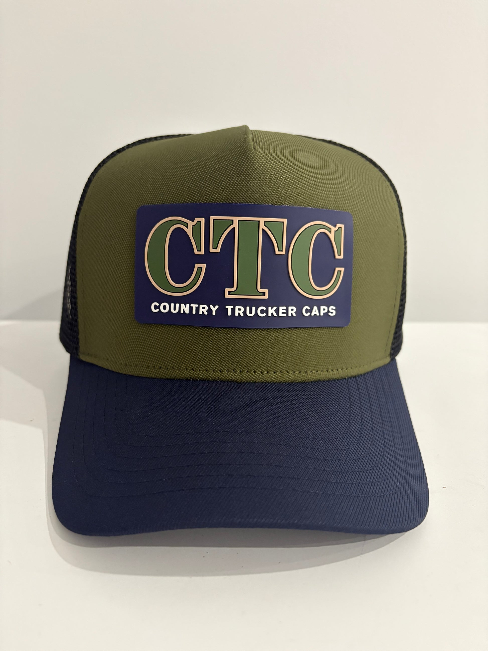 NAVY RUBBER PATCH TRUCKER CAP