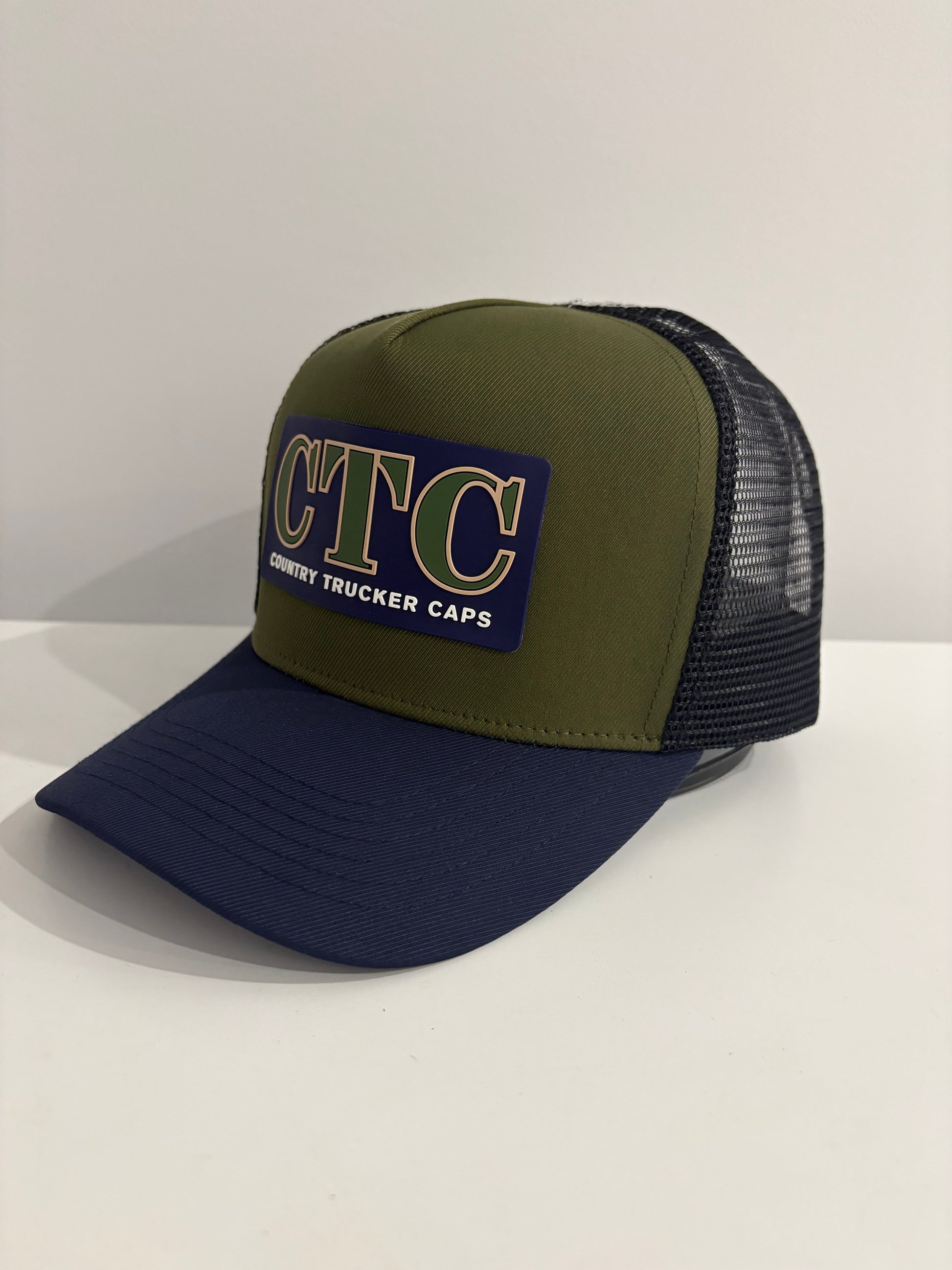 NAVY RUBBER PATCH TRUCKER CAP