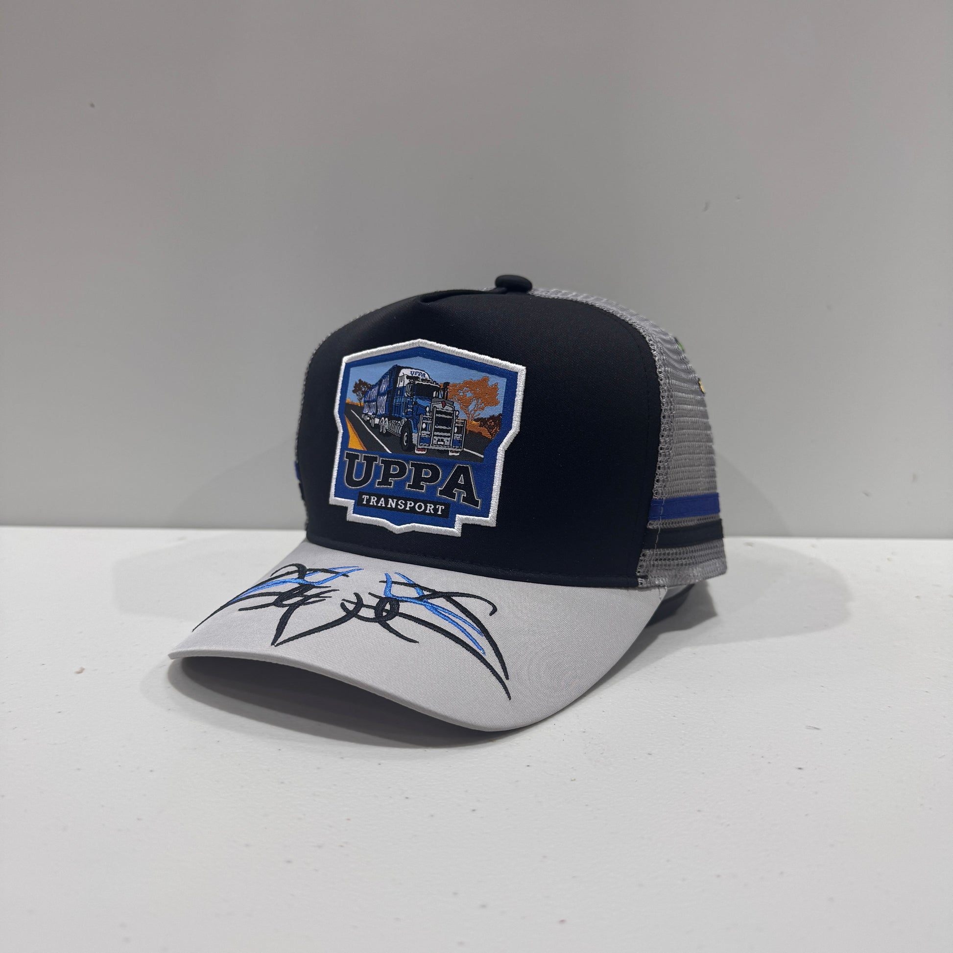 UPPA BLUE BADGE TRUCKER CAP – The Country Companies