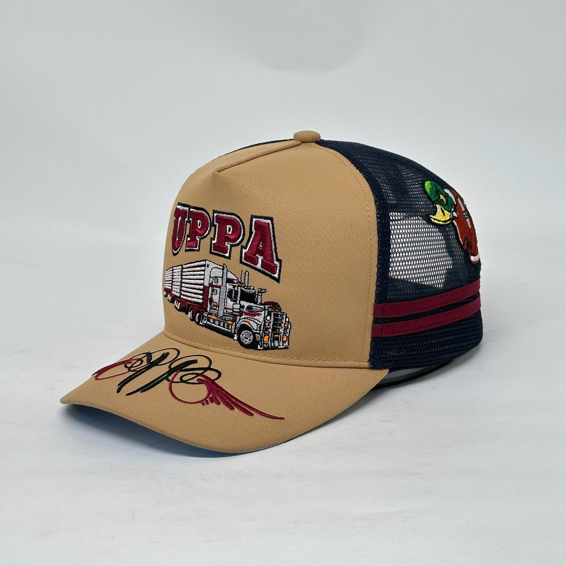 UPPA CARAMEL NAVY TRUCKER CAP