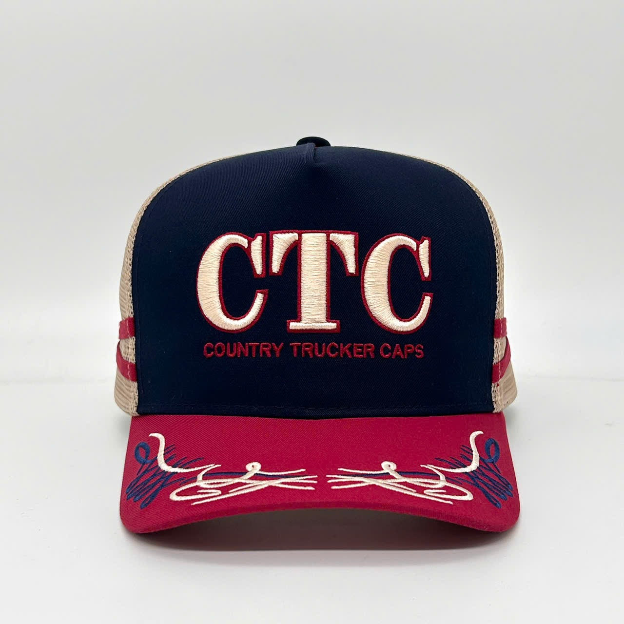 NAVY CHERRY TRUCKER CAP