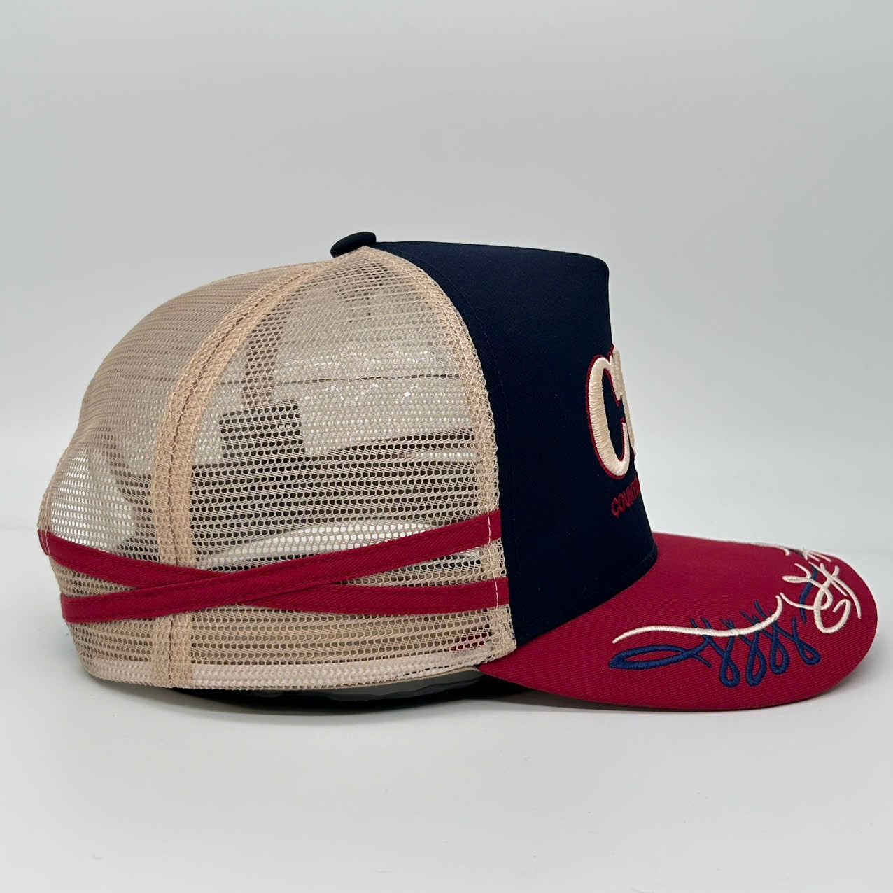 NAVY CHERRY TRUCKER CAP