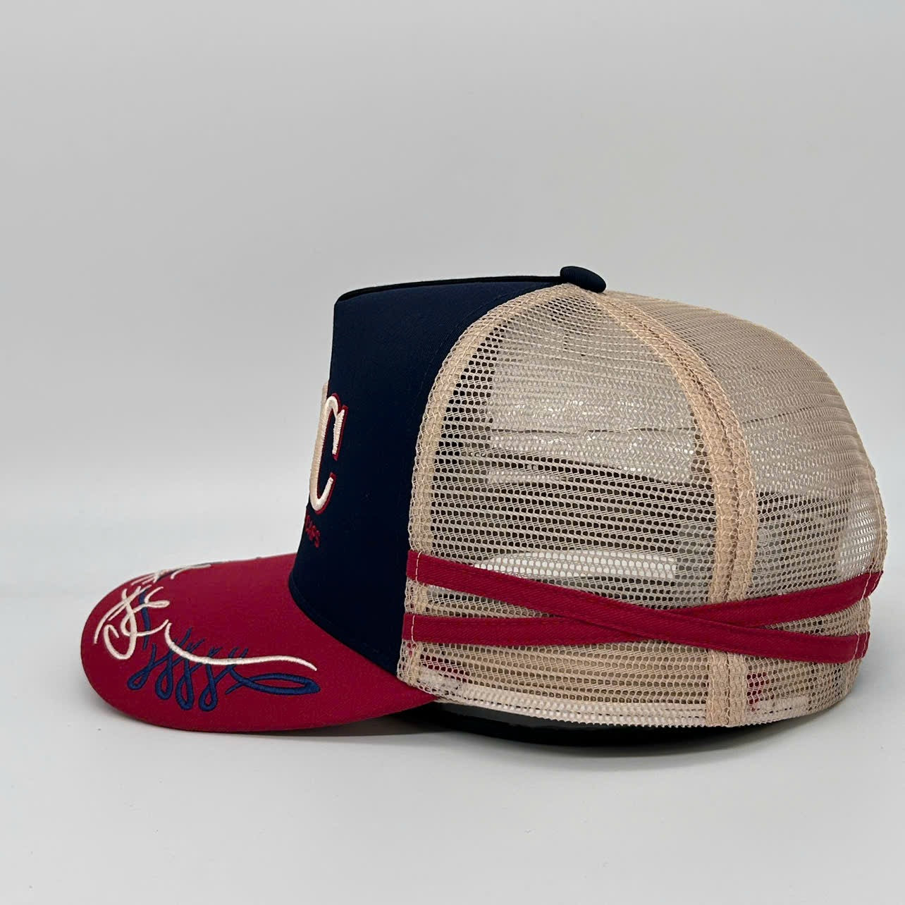 NAVY CHERRY TRUCKER CAP