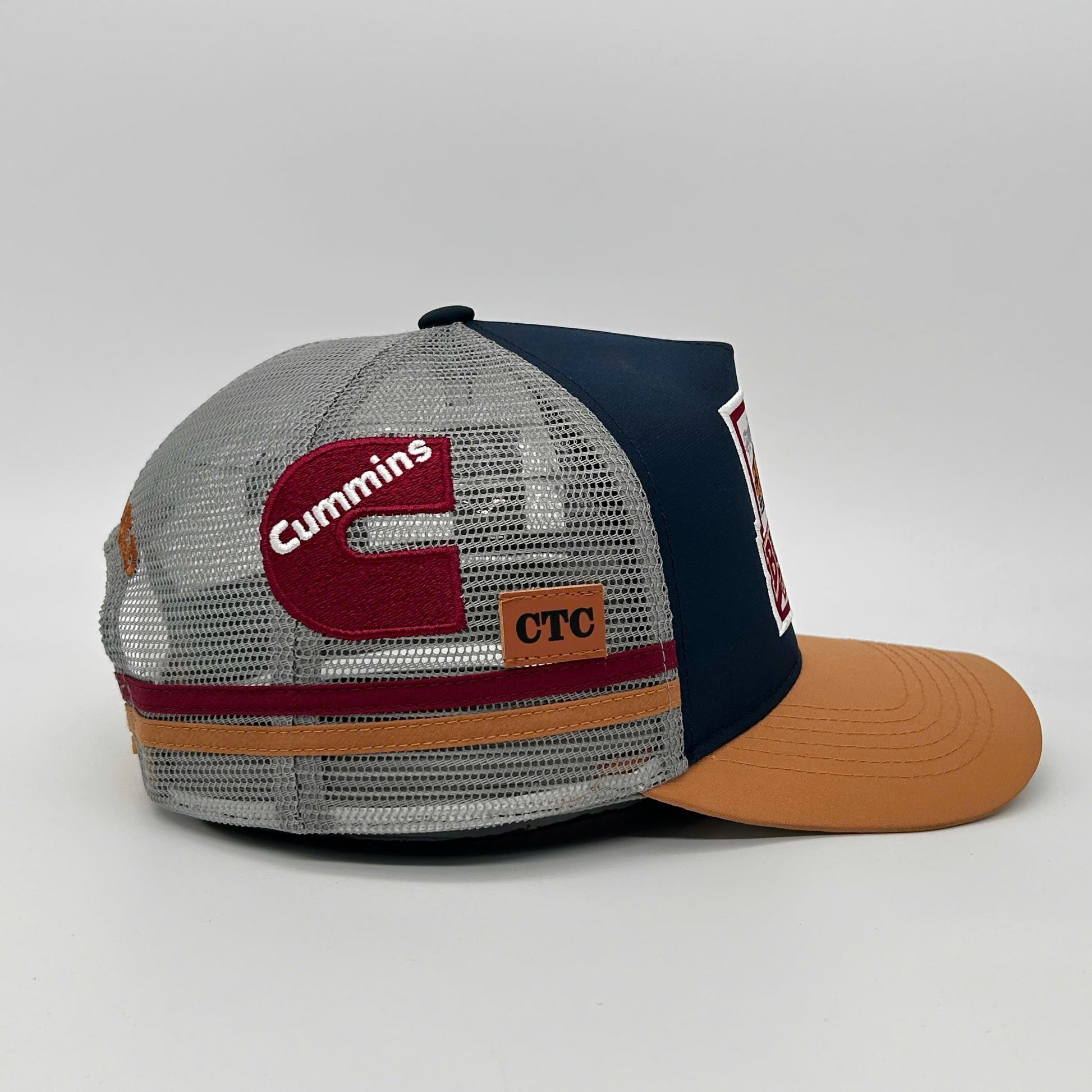 BURKE NAVY TAN TRUCKER CAP