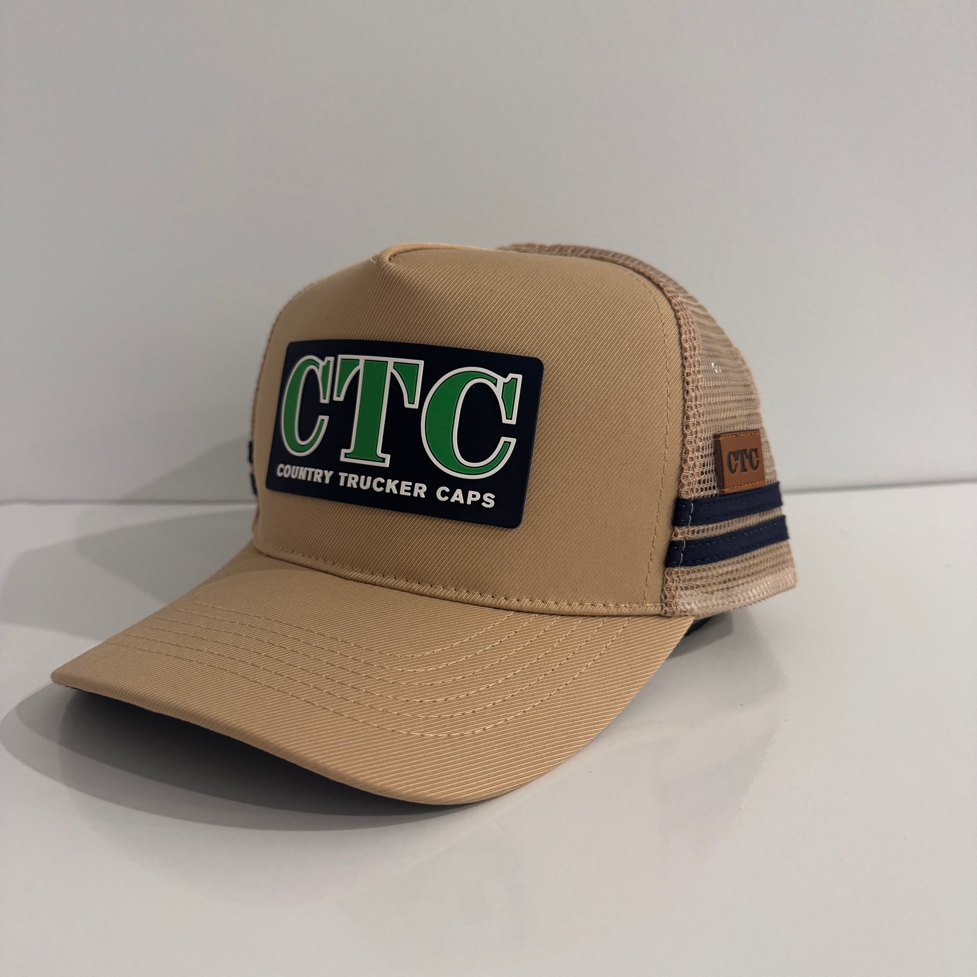 BEIGE RUBBER PATCH TRUCKER CAP