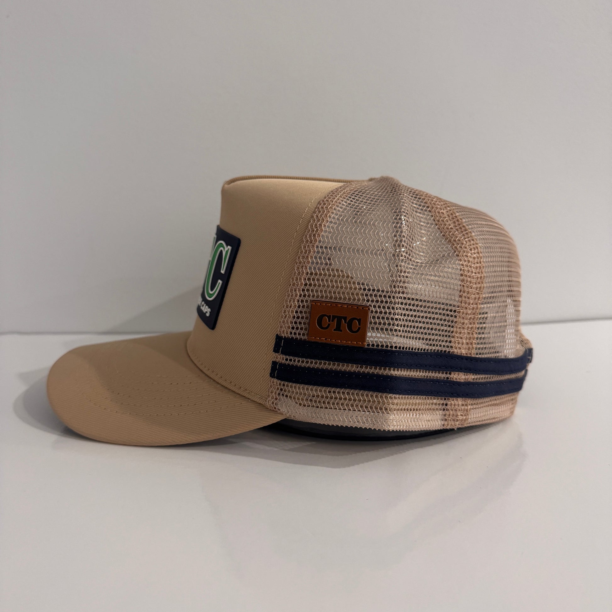 BEIGE RUBBER PATCH TRUCKER CAP
