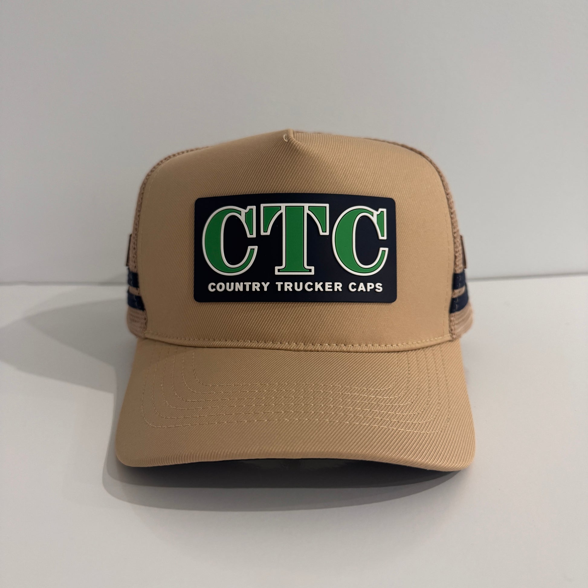 BEIGE RUBBER PATCH TRUCKER CAP